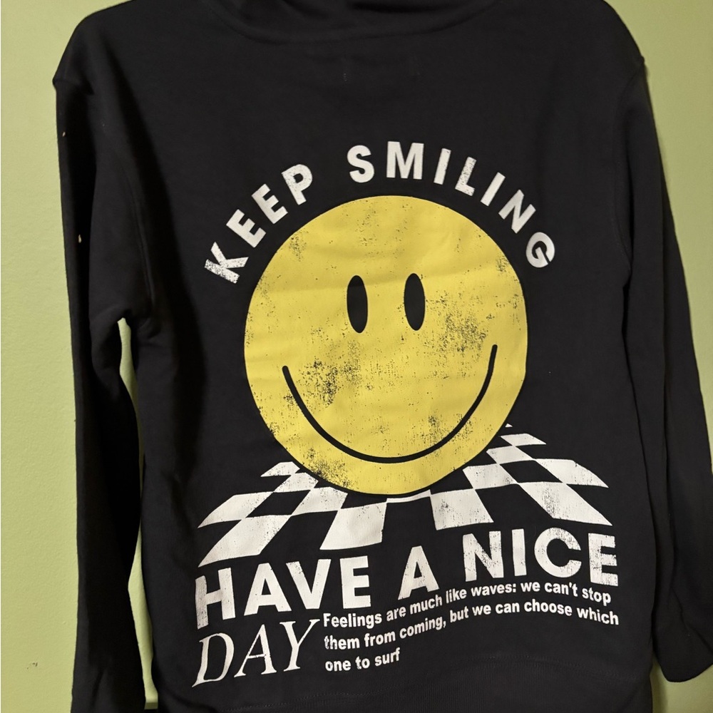 Black Smiley Face Youth Hoodie. Size medium. NWT